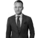 En profilbild av fastighetsmäklare Christian Malmsäter