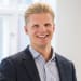 En profilbild av fastighetsmäklare Magnus Ståhl