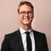 En profilbild av fastighetsmäklare Axel Lundius