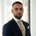 En profilbild av fastighetsmäklare Alexander Shahin