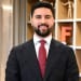 En profilbild av fastighetsmäklare Marcus Deniz