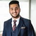 En profilbild av fastighetsmäklare Josef Khan