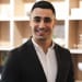 En profilbild av fastighetsmäklare Kevin Ibrahim