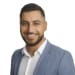 En profilbild av fastighetsmäklare Ahmed Waad