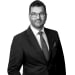 En profilbild av fastighetsmäklare Daniel Sedman