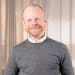 En profilbild av fastighetsmäklare Niclas Andersson