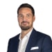En profilbild av fastighetsmäklare Martin Funck