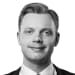En profilbild av fastighetsmäklare Felix Wikström