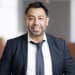 En profilbild av fastighetsmäklare Claudio Pino