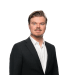 En profilbild av fastighetsmäklare Marc Törnsten