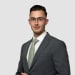 En profilbild av fastighetsmäklare Michel Dagher