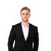 En profilbild av fastighetsmäklare Alexander Rudenok