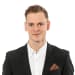 En profilbild av fastighetsmäklare Martin Rigvald
