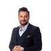En profilbild av fastighetsmäklare Zahed Ganjali