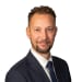 En profilbild av fastighetsmäklare Charlie Siltberg