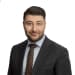 En profilbild av fastighetsmäklare Seydo Aydogan