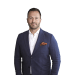 En profilbild av fastighetsmäklare Max Stendahl