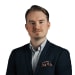 En profilbild av fastighetsmäklare Christopher Bergquist