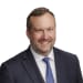 En profilbild av fastighetsmäklare Robert Kullberg