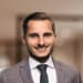 En profilbild av fastighetsmäklare Ramzi Hamam