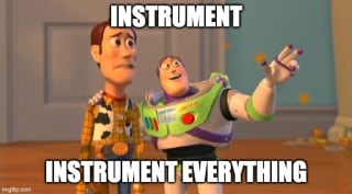 Buzz, a hand on Woody's shoulder, telling him "Instrument, instrument everything".