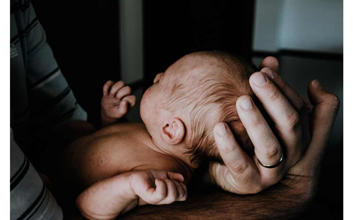 Holding a baby by Kelly Sikkema on Unsplash