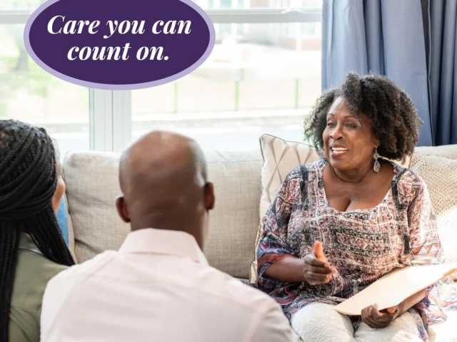 Newborn care specialist educating a family on how to take care of their baby