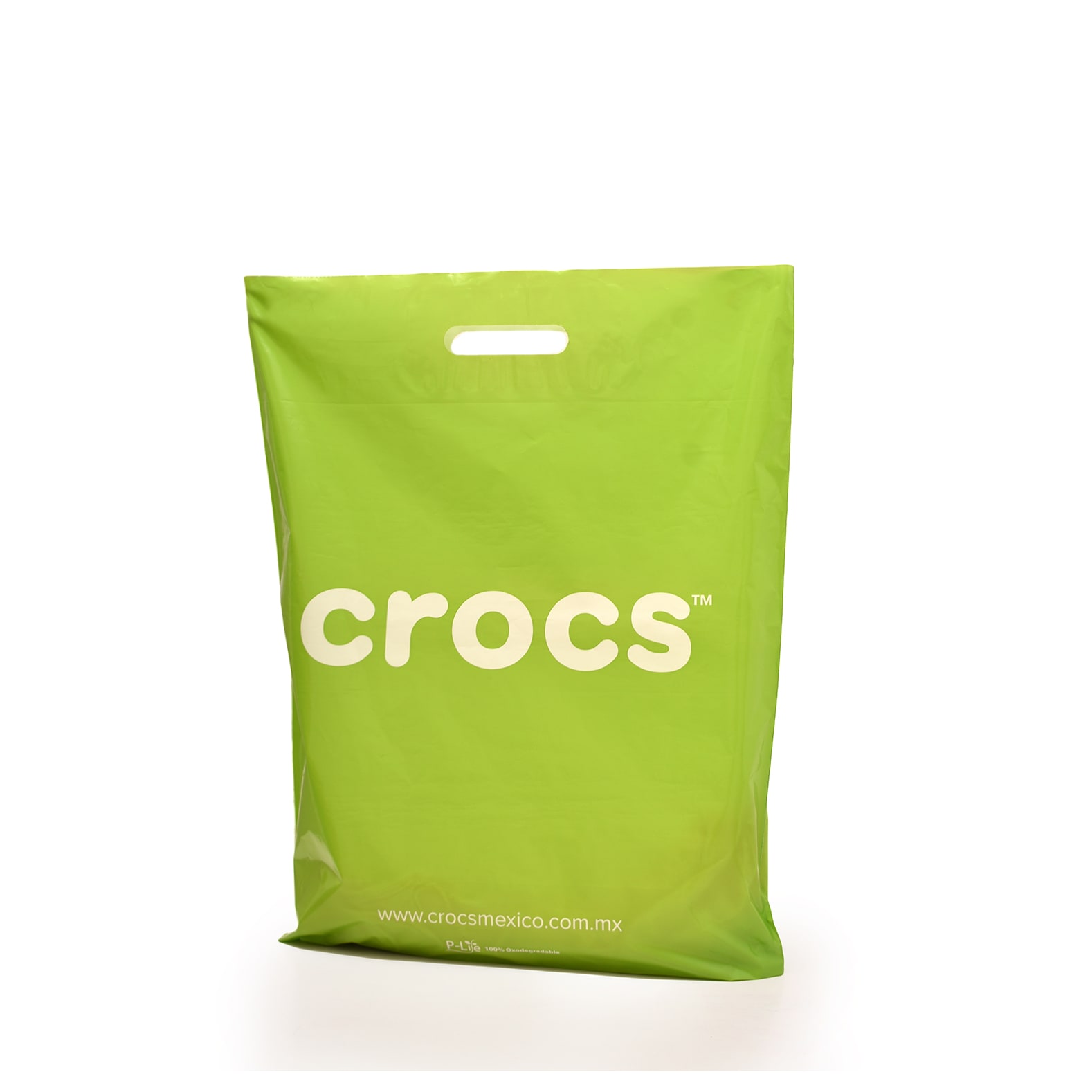 Bolsa de color verde impresa para calzado de la marca: Crocs.