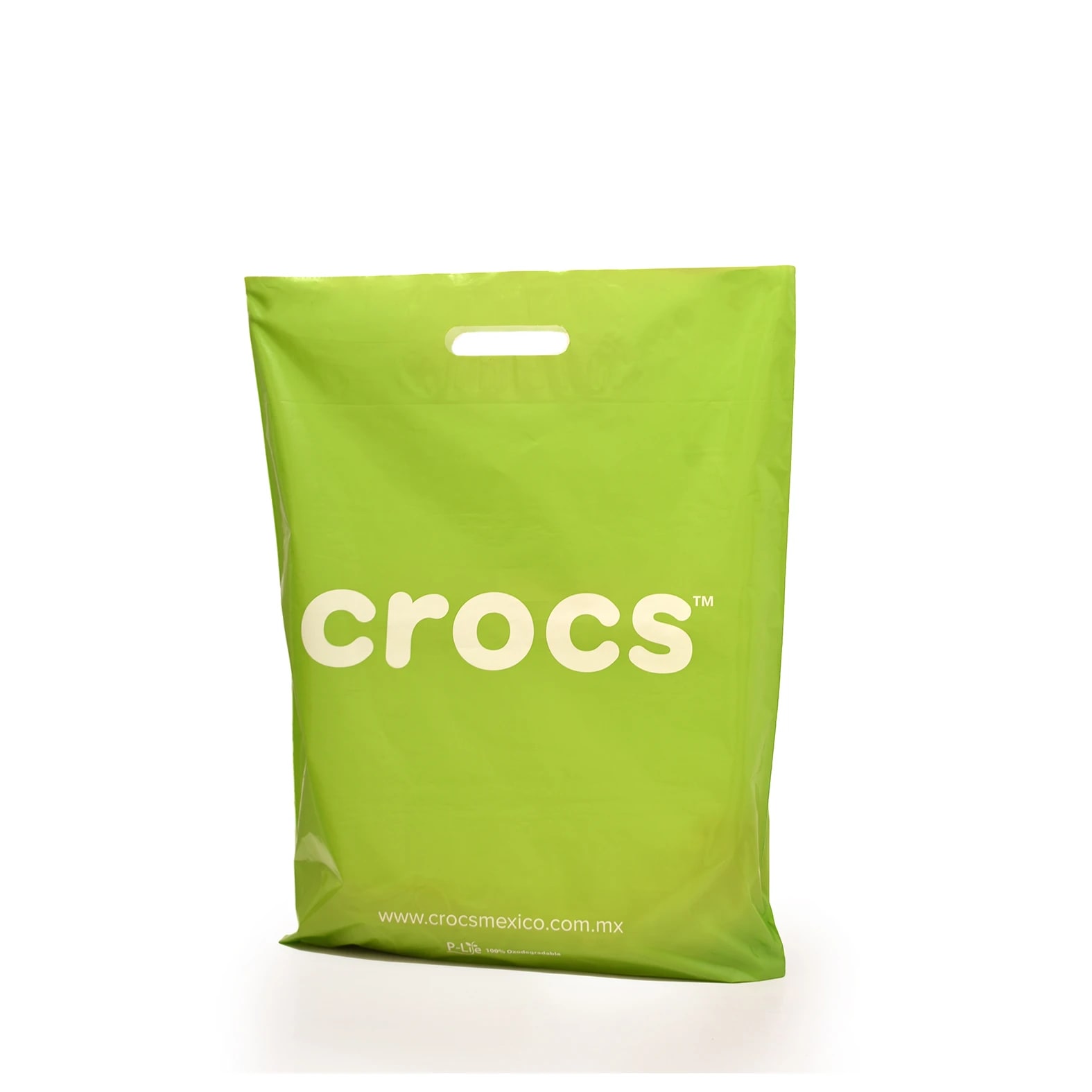 Bolsa de color verde impresa para calzado de la marca: Crocs.