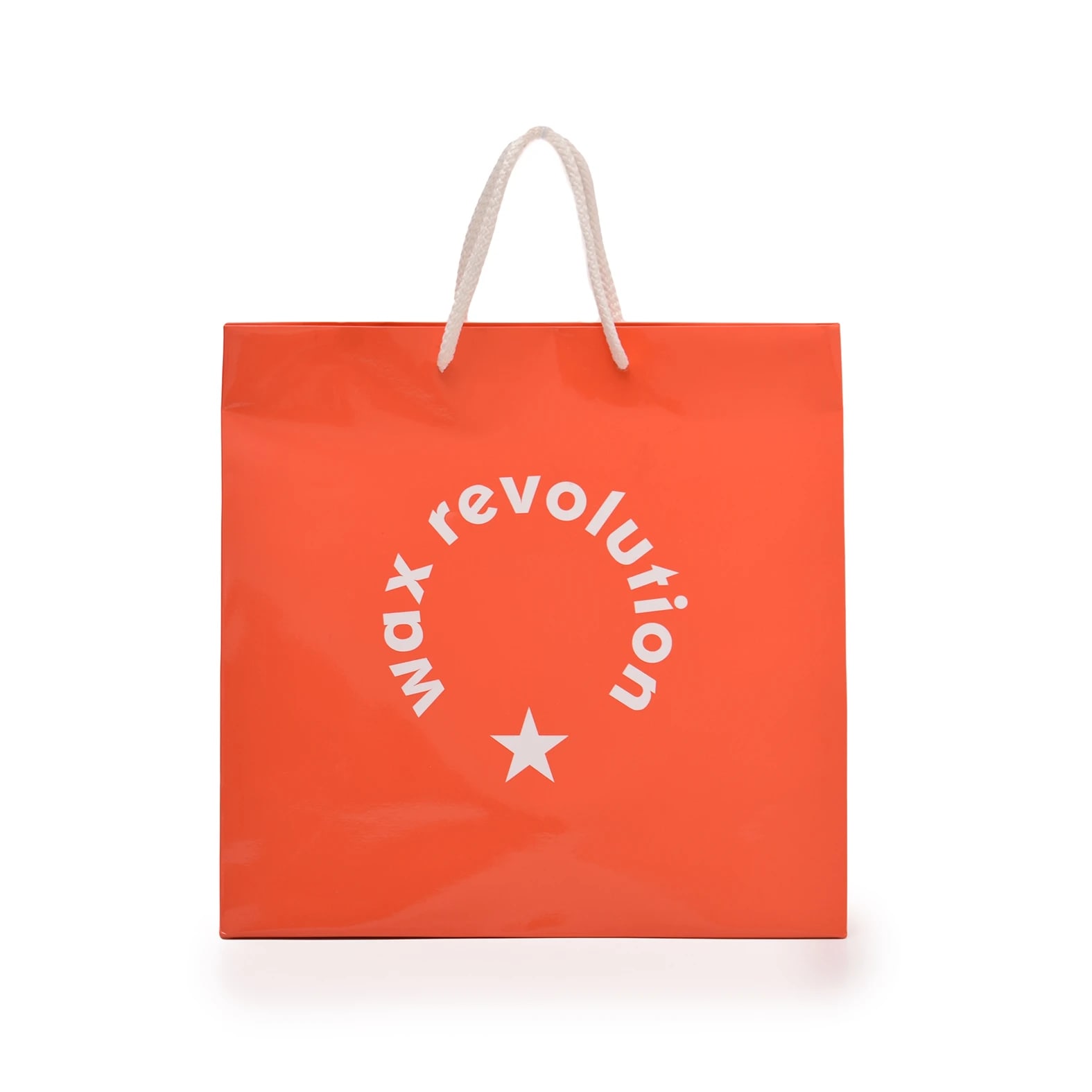 Bolsa impresa en color naranja con logotipo y diseño de la marca: Wax Revolution.