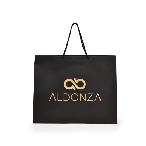 Bolsa impresa con el logotipo fabricada en papel Couché con asa de listón.