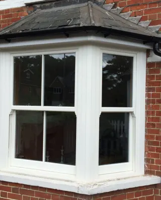 3 Part Bay and 3 Connected Windows with Single Vertical Bar and White Woodgrain Finish
