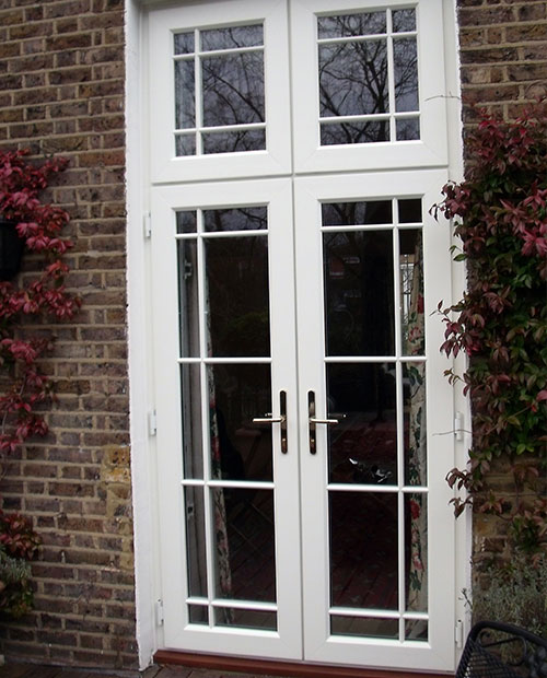 French doors with additional casement window section above.