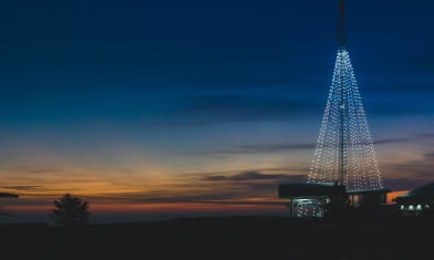 Stone Mountain's Chistmas Tree glowing bright just before sunrise.