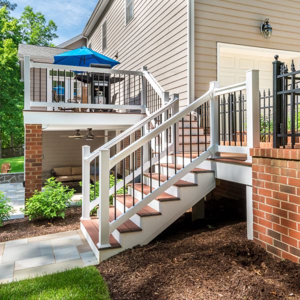 Updated back deck with steps leading to the patio and lawn