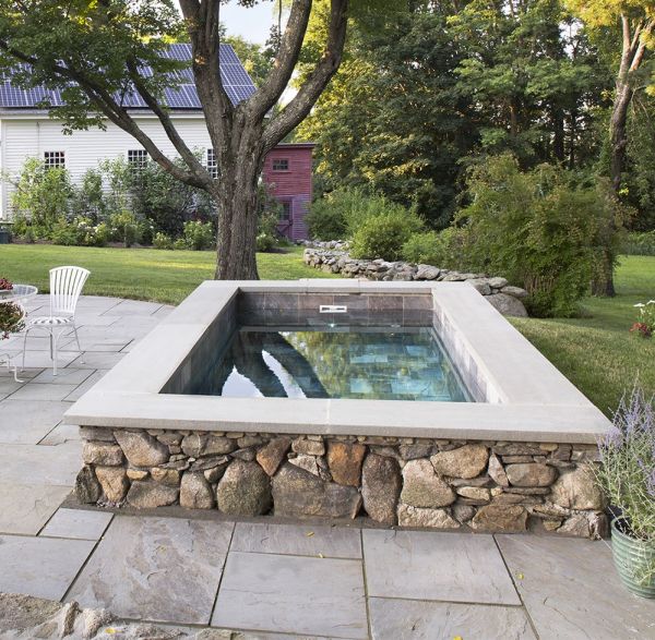 Plunge pool with fountain and paver patio decking