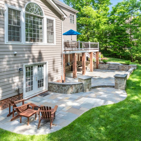 New patio installed with a knee wall and deck