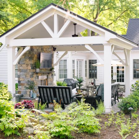 Custom pavilion offers shade and a fan for the lounge area outside in the back yard