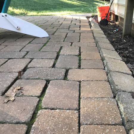 paver patio had bricks settling with large gaps between them