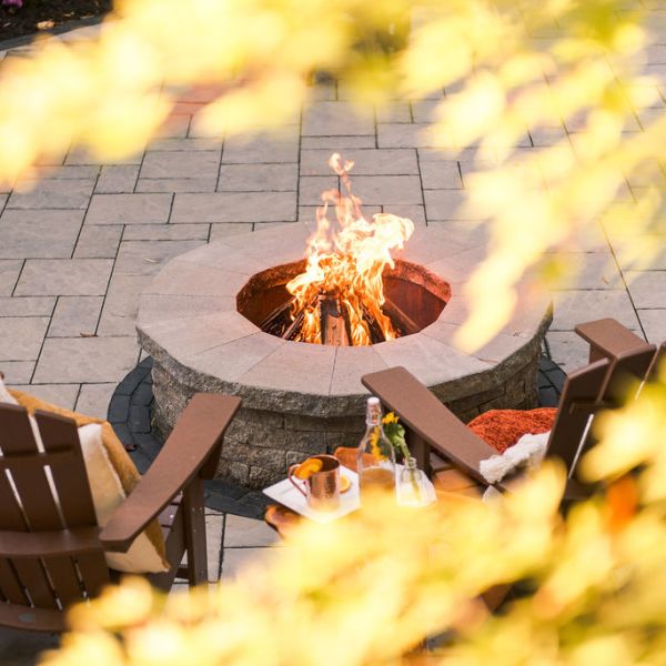 Roaring fire in a custom built stone fire pit