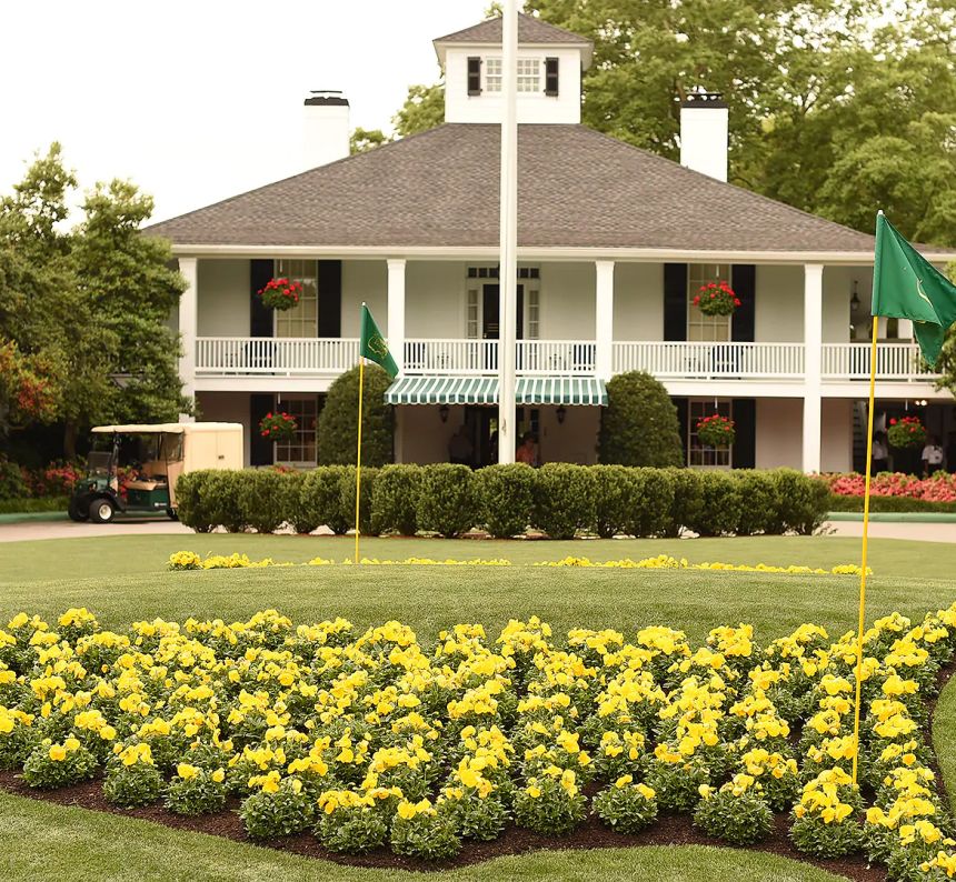 The clubhouse entry at Augusta National with yellow pansy logo