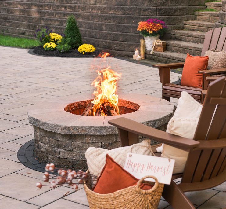 Wood burning fire pit on a paver patio