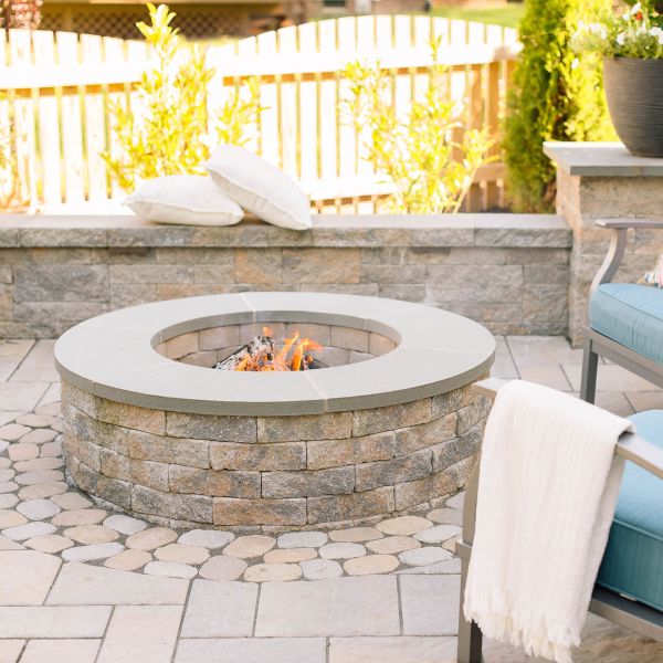 classic permanent fire pit installed in patio