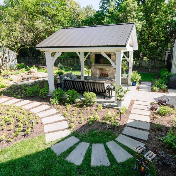 light grey natural Stepping stone walkway through the backyard and around the pavilion