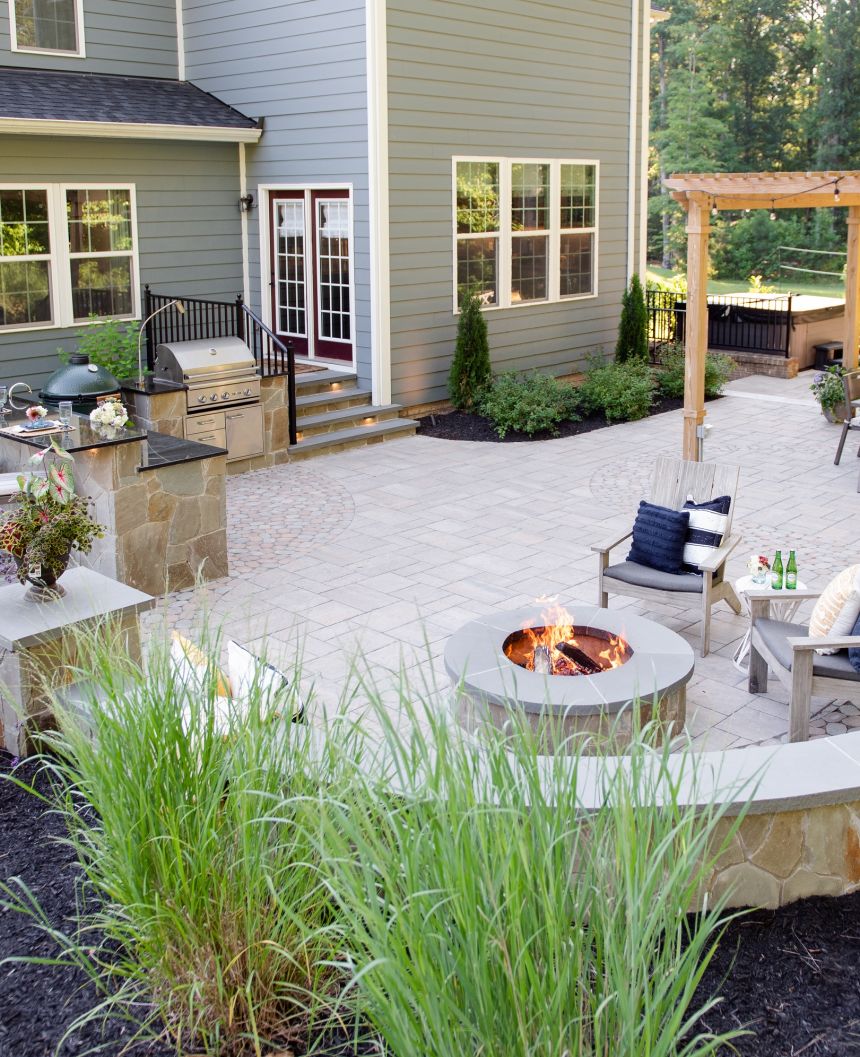 Paver patio with pergola, fire pit and outdoor kitchen