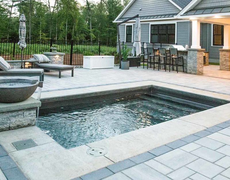 Plunge pool with fountain and paver patio decking