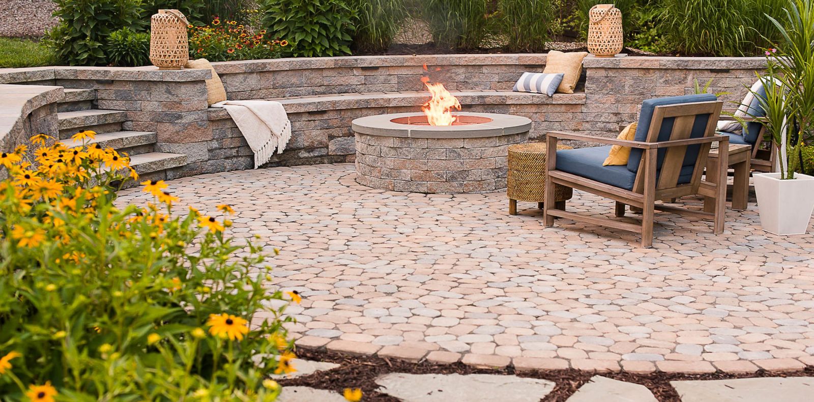 Circular stone fire pit witting wall and steps