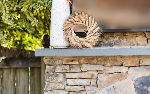 Outdoor fireplace stone mantel