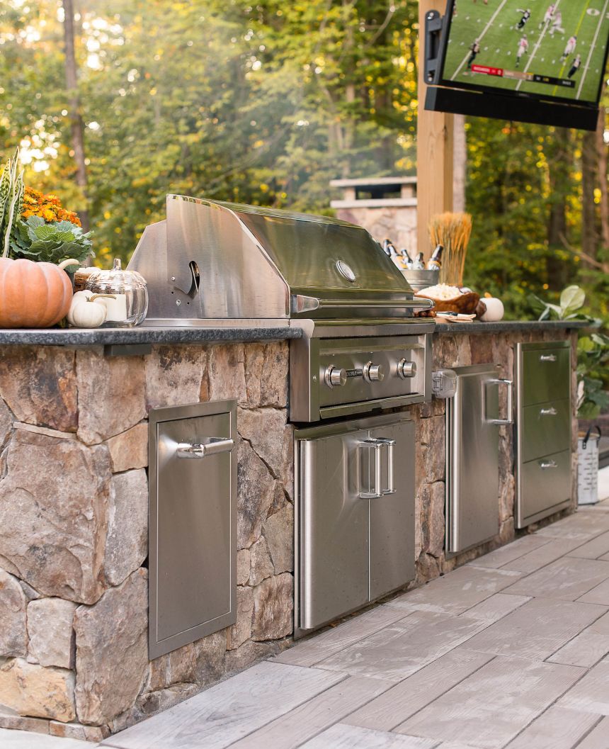 Outdoor kitchen with premium grill and outdoor television