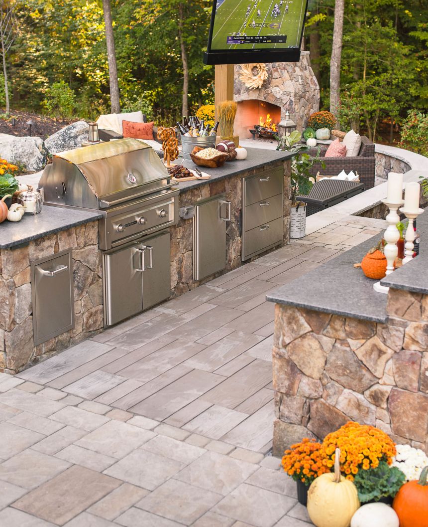 Stone outdoor kitchen with outdoor television